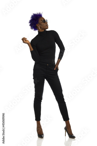 Black Young Woman With Short Purple Hair Is Posing In Sunglasses. Full length. Isolated