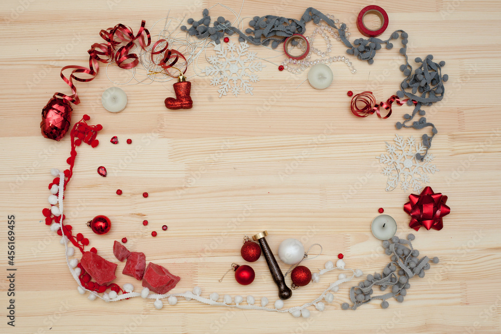 christmas decorations on a wooden background, a frame of christmas decorations and ribbons, preparation for the new year and christmas
christmas decorations on a wooden background, a frame of christmas decorations and ribbons, preparation for the new year and christmas