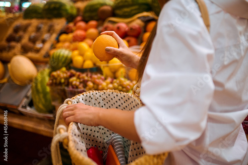 A pisture of a female client in a fruits store photo