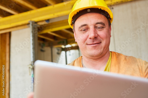 Foreman with tablet computer during construction planning