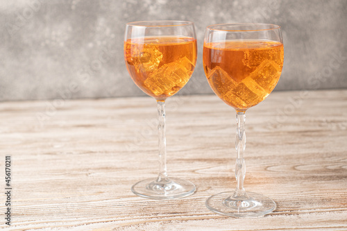 Homemade Aperol spritz. Orange cocktails on wooden table. Simple Aperol Spritz Recipe. Aperol spritz in a glass with ice