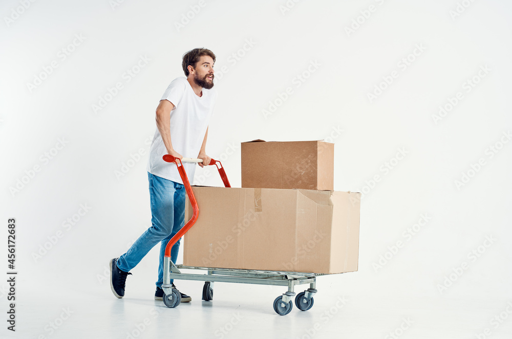bearded man shipping transport in a box light background bearded man shipping transport in a box light background