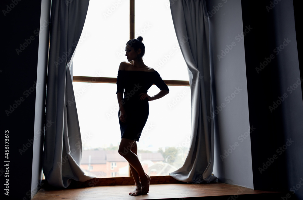 woman posing near window home interior model