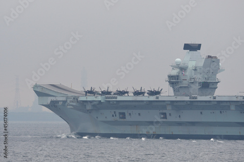 Royal Navy aircraft carrier HMS Queen Elizabeth sailing in Tokyo Bay.