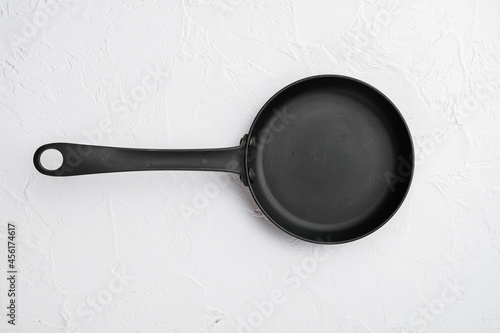 Empty skillet, frying pan with copy space for text or food with copy space for text or food, top view flat lay , on white stone table background