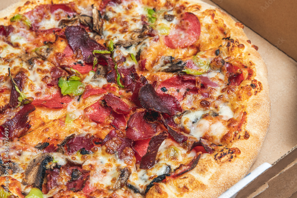 Top view of hot pizza in recycled pizza box. Top view of hot pizza in recycled pizza box.