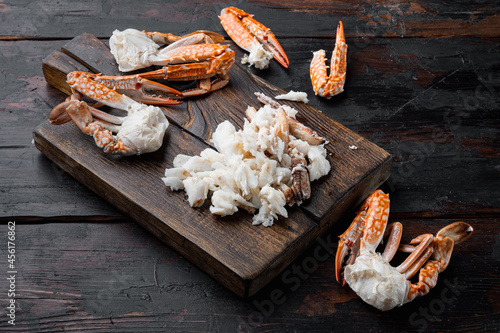 Boiled Blue swimmer crab meat or Horse Blue crab, Flower crab, on wooden cutting board, on dark wooden background photo