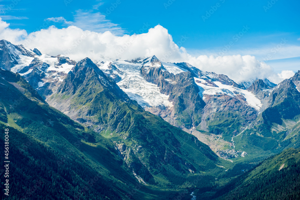 Mountain valley among the hills. Green mountain panorama. Mountain panoramic landscape. Beautiful mountain panorama