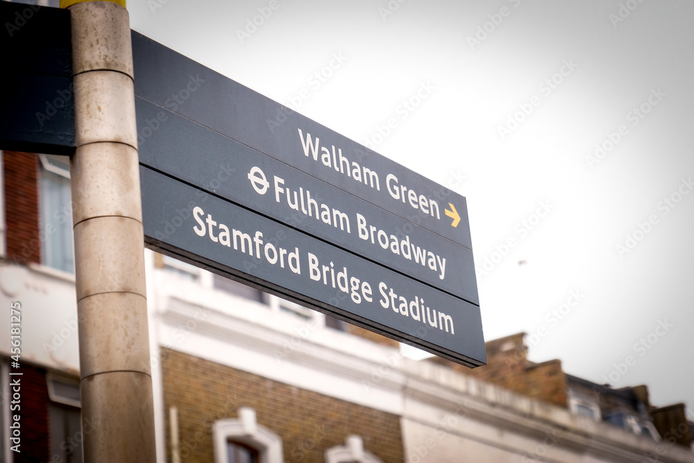 London- Directional street sign in west London for  Chelsea FC's Stanford Bridge Stadium and Fulham Broadway underground station