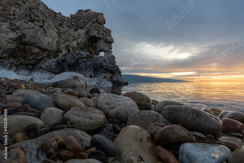 Stone arch in the rock on the shore of Lake Baikal