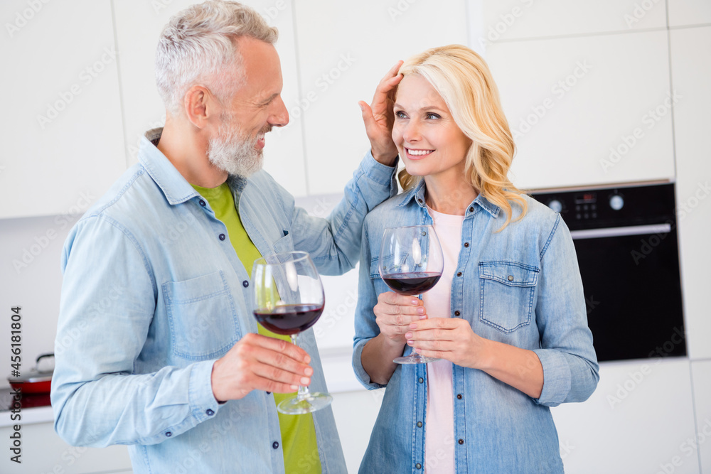 Photo of smiling good mood married couple wife and husband drinking wine celebrate marriage anniversary romantic night Photo of smiling good mood married couple wife and husband drinking wine celebrate marriage anniversary romantic night