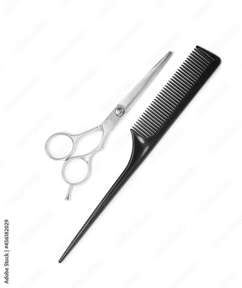 Professional hairdresser scissors and black comb isolated on white, top view. Haircut tools Professional hairdresser scissors and black comb isolated on white, top view. Haircut tools