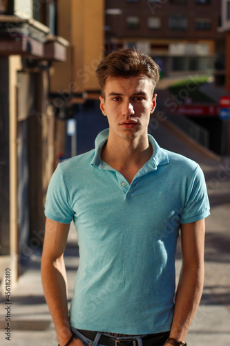 young man walking on street