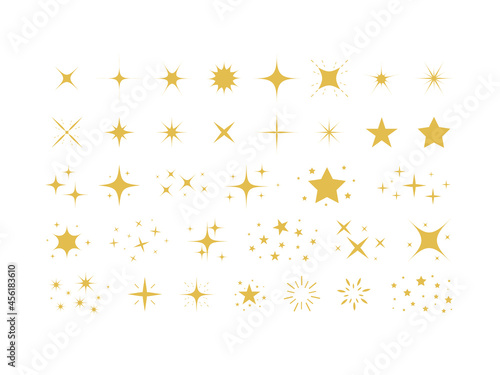 Set of gold stars and sparkles isolated on white background. Sparkles symbols. Sparks and stars Vector illustration