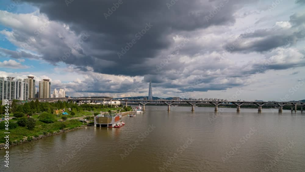 Time lapse. Seoul Subway with traffic on bridge and Seoul City Sky showing tower in the financial district at Han river Seoul, South korea. Time lapse. Seoul Subway with traffic on bridge and Seoul City Sky showing tower in the financial district at Han river Seoul, South korea.