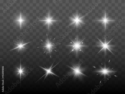 Set of shining sparkles and lens flares. Glowing lights isolated on transparent background. Vector illustration