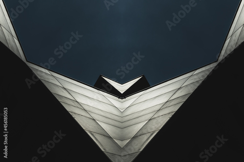 abstract, architectural symmetric Background - Metallic fascade of a modern Office building against blue sky photo