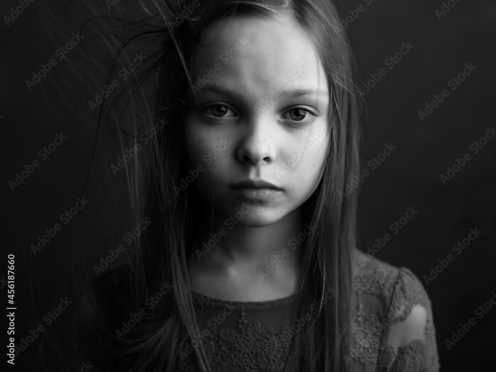 little girl posing long hair close-up black and white photo