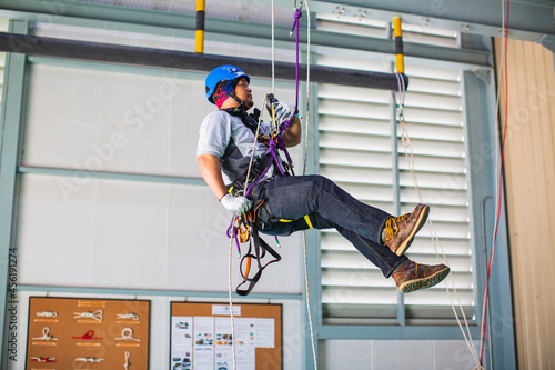 Male worker training rope access