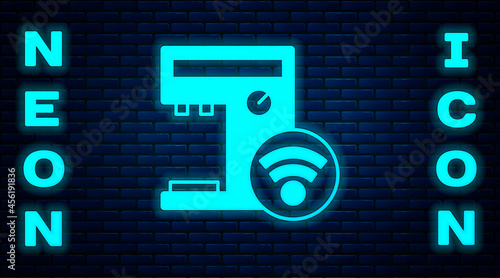 Glowing neon Smart coffee machine system icon isolated on brick wall background. Internet of things concept with wireless connection. Vector