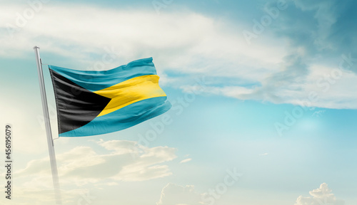 Bahamas national flag cloth fabric waving on the sky with beautiful sun light - Image