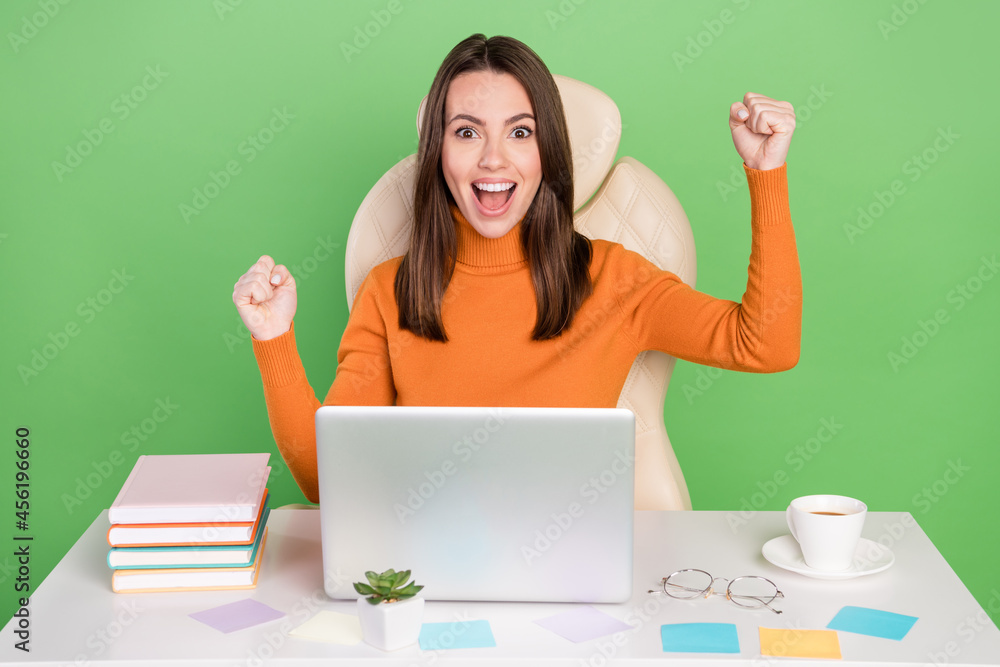 Portrait of pretty lucky trendy amazed cheerful girl agent broker rejoicing having fun isolated over bright green color background Portrait of pretty lucky trendy amazed cheerful girl agent broker rejoicing having fun isolated over bright green color background