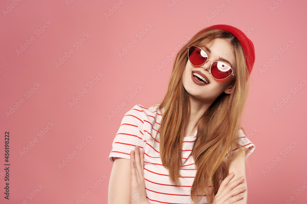 cheerful fashionable woman in red hat summer style posing