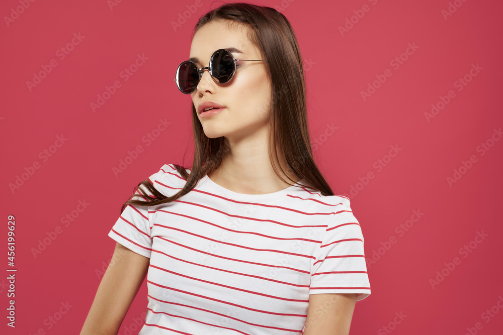 Fototapeta premium cheerful pretty woman wearing sunglasses striped tshirt fashion modern style