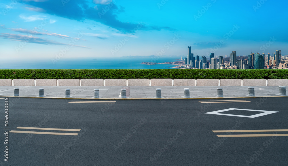 Fototapeta premium Road and city buildings background