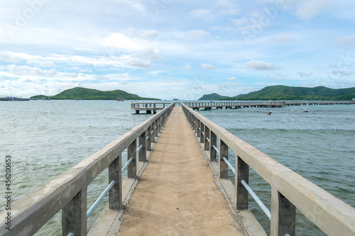 the wooden bridge pier between clearly sky at Pattaya, Thailand