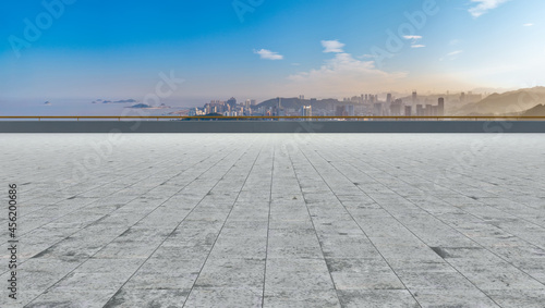 Square floor tiles and city buildings background © 昊 周