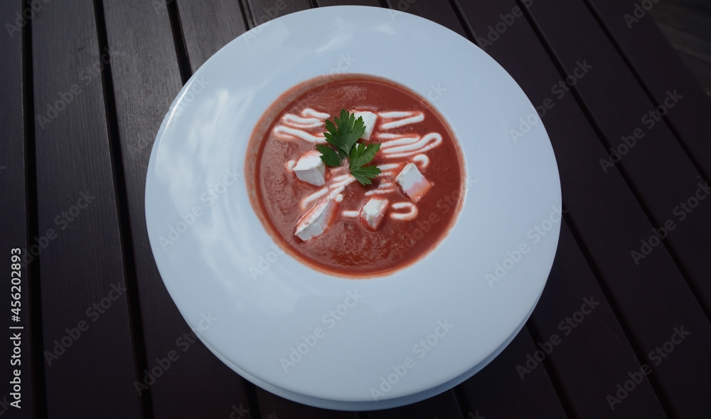 Tomato soup in a restaurant by the pond Tomato soup in a restaurant by the pond