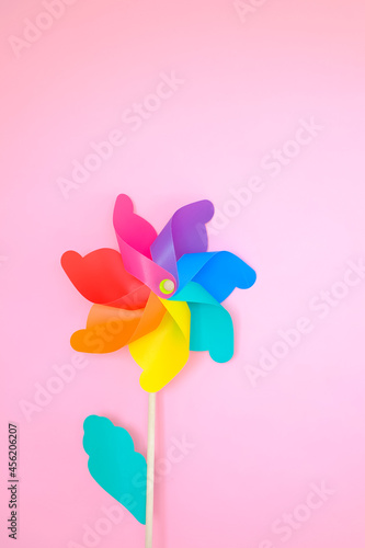 colorful wind turbine or pinwheel or wind toy on pink background © u photostock