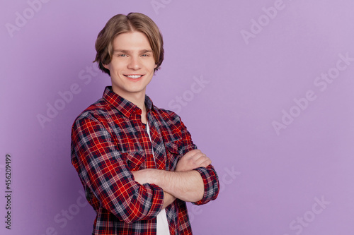 Portrait of nice attractive confident guy crossed arms toothy beaming smile on purple background