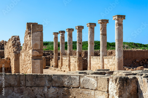 Roman Column architecture building,ruins at the Paphos Archaelogical Park in Cyprus which is a popular tourist holiday travel destination and landmark attraction, stock photo image