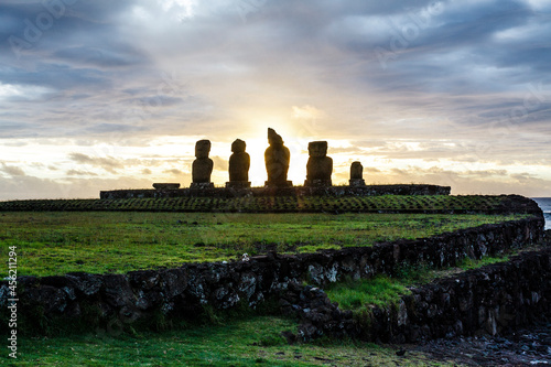 Sunset at Ahu Tahai, site with moai statues at Easter Island, Chile