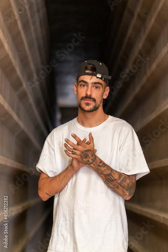 Good-looking guy between concrete walls