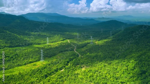 Aerial view Hyperlapse by drone The view is beautiful in the morning during over the mountains. On the mountain there is a large line of power transmission towers, Pang Pue Mae Moh, Lampang, Thailand.