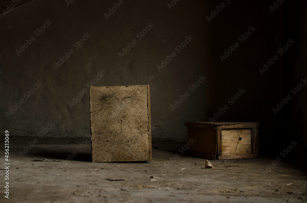Two old wooden mailboxes in the corner of the attic
Two old wooden mailboxes in the corner of the attic