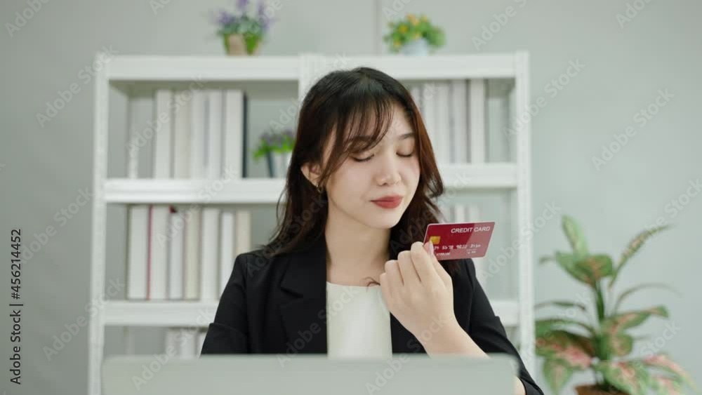 young Asian woman is using a credit card for a smartphone transaction. iot concept, internet of things
young Asian woman is using a credit card for a smartphone transaction. iot concept, internet of things