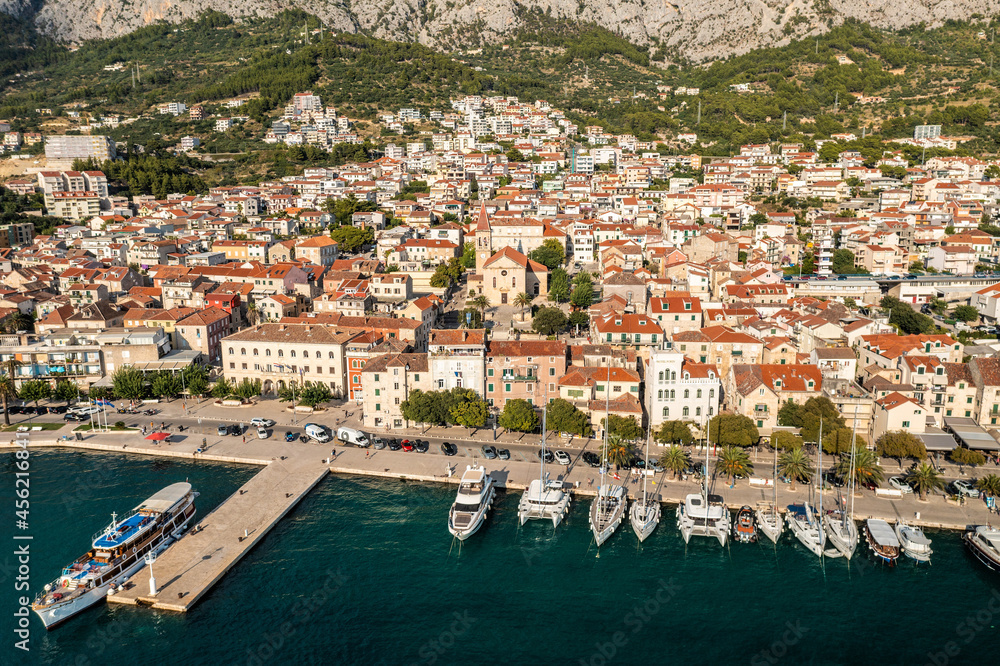 Aerial view of Makarska town below Biokovo mountain, the Adriatic Sea, Croatia