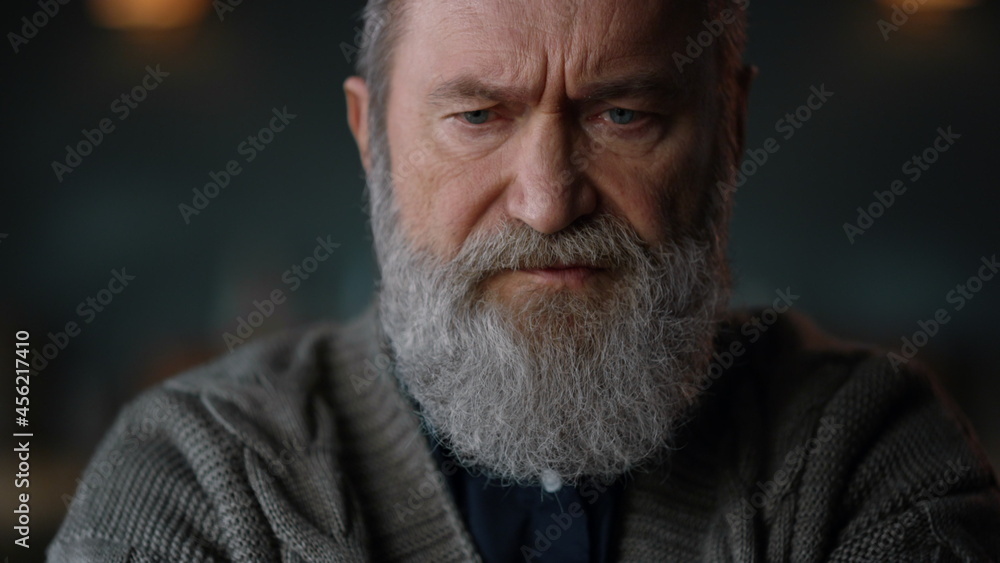 Old man saying no during web conference. Senior businessman having video call Old man saying no during web conference. Senior businessman having video call