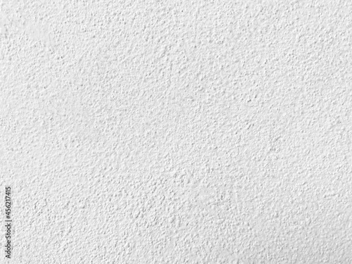 Seamless texture of white old cement wall a rough surface, with space for text, for a background..