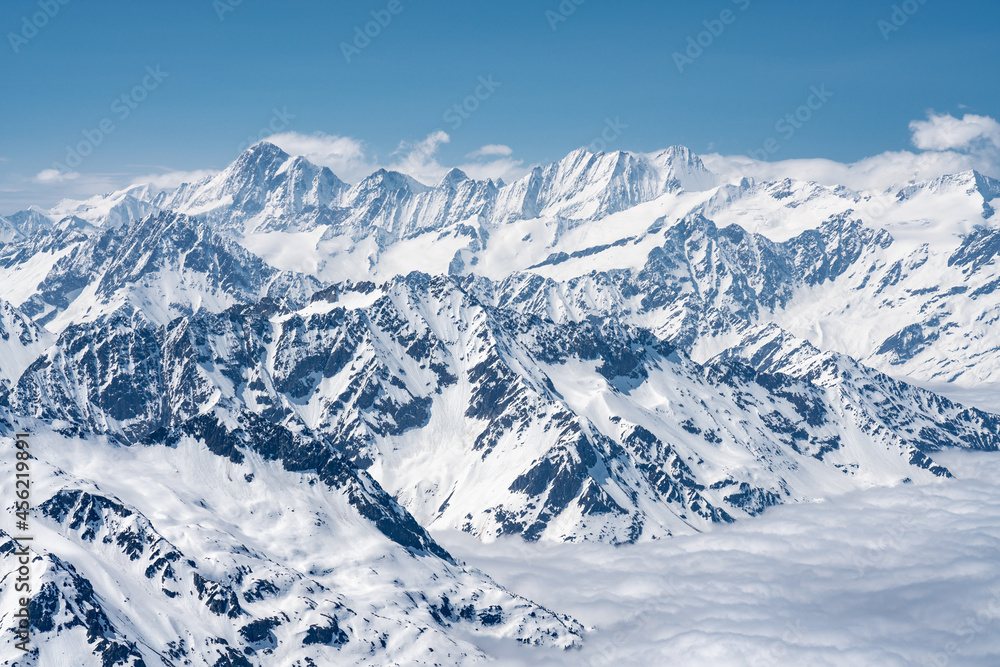 Fototapeta premium Switzerland, Panoramic view on Snow Alps and Blue Sky around Titlis mountain