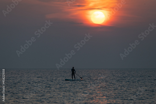 paddle boarder enjoying the last of the sun © Keith