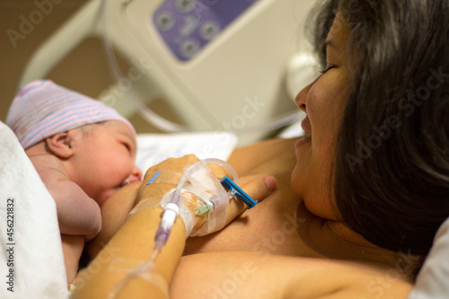 Laid directly on the mother's bare chest after birth, Skin to skin