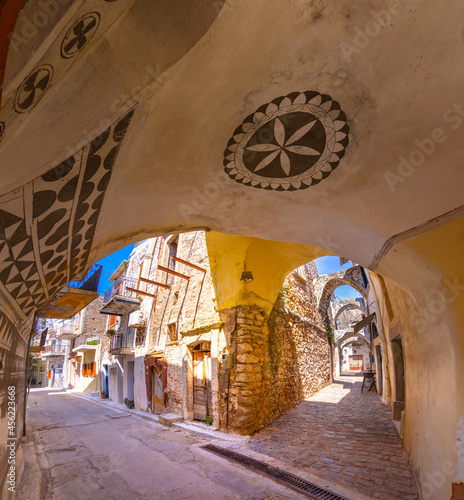 Traditional houses and churches decorated with the famous geometric scratch patterns in the medieval mastic village of Pyrgi on the island of Chios, Greece photo