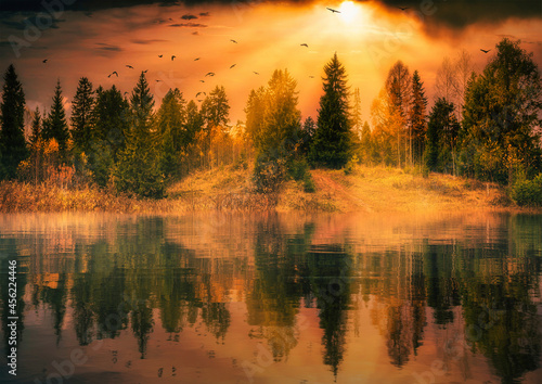 beautiful autumn dramatic landscape of late autumn the reflection of trees in the water the rays of the sun © Konstantin