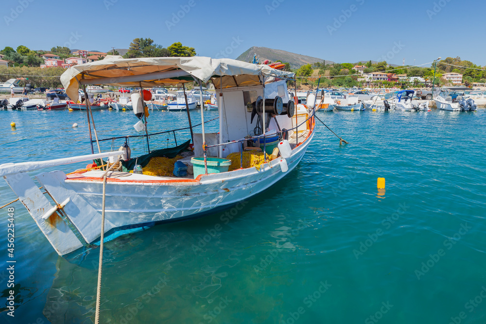 Small wooden fishing boat moored in Greek port