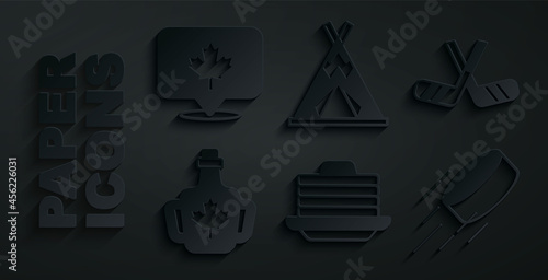 Set Stack of pancakes, Ice hockey sticks, Bottle maple syrup, Hockey puck, Indian teepee or wigwam and Canadian leaf icon. Vector